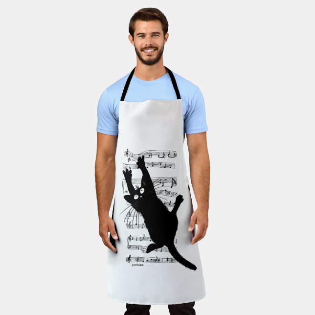 The cat hangs on musical notes apron (Worn)