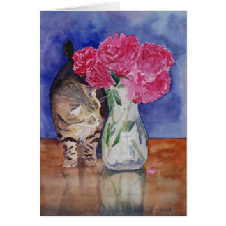 The cat just has to smell the beautiful peonies.