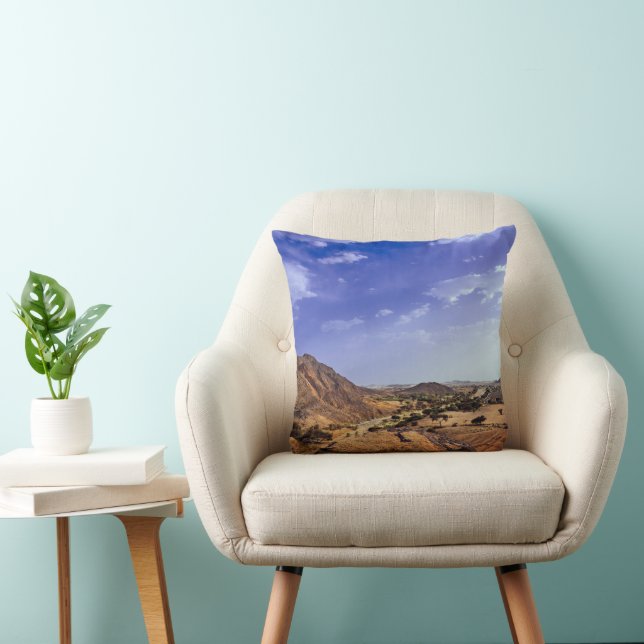 The charming beauty of desert nature under a blue  cushion (Chair)