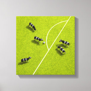 The cows playing soccer canvas print