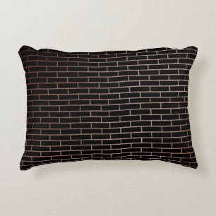The dark black brick wall has a rough surface as a decorative cushion