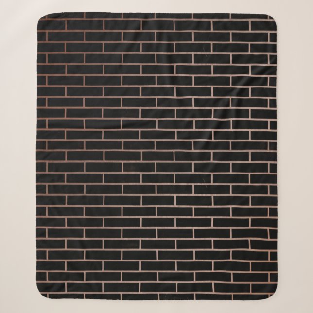 The dark black brick wall has a rough surface as a sherpa blanket (Front)