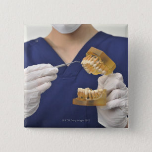 The dentist explained with a dental model 15 cm square badge