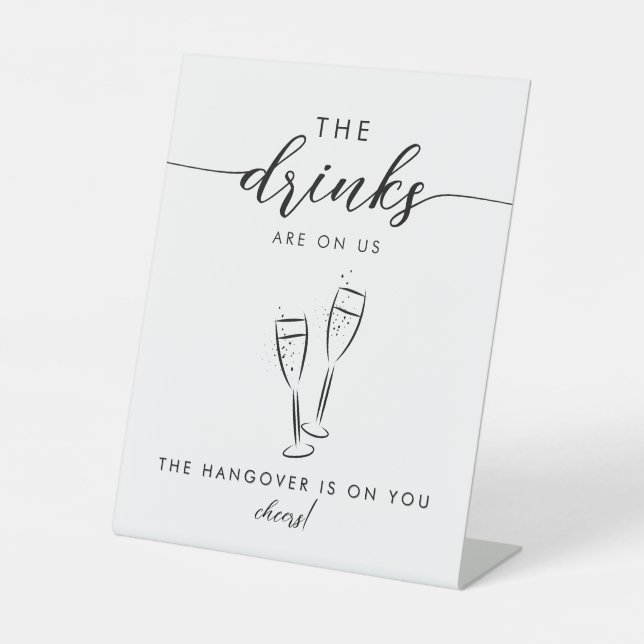 The Drinks Are On Us Modern minimalist Black White Pedestal Sign (Front)