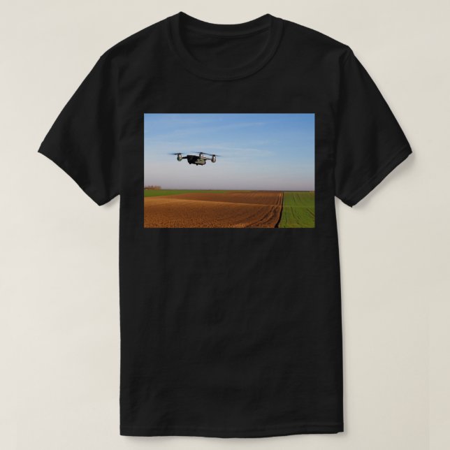 The drone is flying over the ploughed field 1 T-Shirt (Design Front)