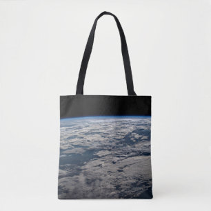 The Earth's Limb Above A Cloudy Western Australia. Tote Bag