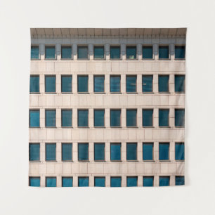 The facade of the modern building with rectangular tapestry