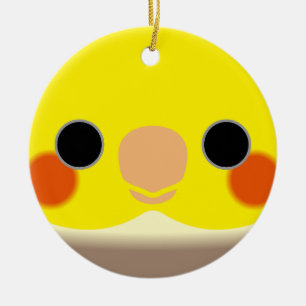 The face of a cinnamon pied male cockatiel ceramic tree decoration