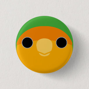 The face of a orange-faced peach-faced lovebird 3 cm round badge