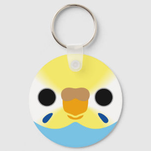 The face of a pastel rainbow female budgie key ring