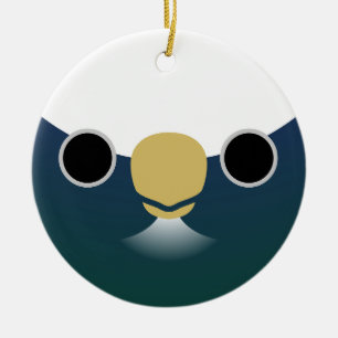 The face of a white-crowned parrot ceramic tree decoration