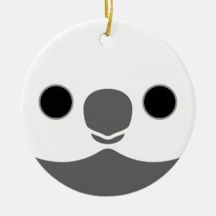 The face of a white-faced male cockatiel ceramic tree decoration