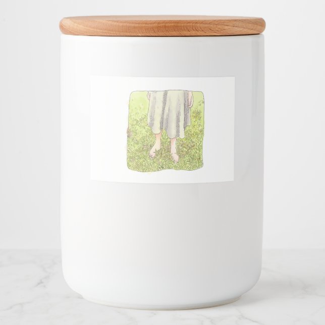 the feet of a one-piece woman standing barefoot on food label (Front)