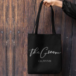 The Groom Personalised Chic Minimalist Wedding Tote Bag<br><div class="desc">This chic,  simple groom black tote bag features your name underneath elegant black typography reading The Groom. Customise these elegant,  modern bridal party gifts in white script for your wedding or bachelor party.</div>