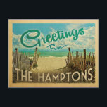 The Hamptons Beach Vintage Travel Postcard<br><div class="desc">This Greetings From The Hamptons vintage postcard design features a sandy beach with a beautiful turquoise ocean water and above the sea,  a blue sky with billowy white clouds. In vintage travels style.</div>