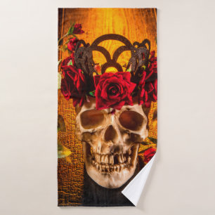 The human skull on the black table lies in the ros bath towel
