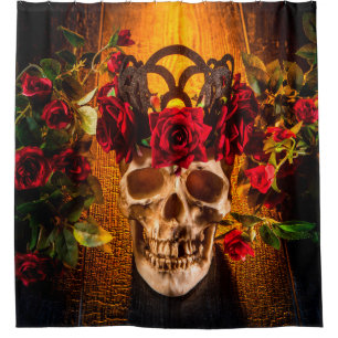 The human skull on the black table lies in the ros shower curtain