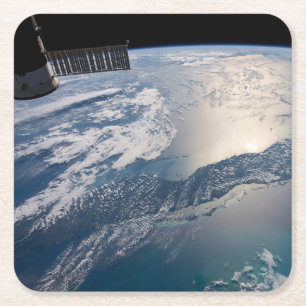 The International Spce Station Above The Atlantic Square Paper Coaster