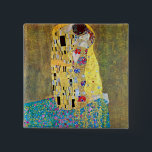 The Kiss by Gustav Klimt, Vintage Art Nouveau 15 Cm Square Badge<br><div class="desc">The Kiss (Der Kuss) (1907/08) by Gustav Klimt is probably his most famous work. Klimt began work on it in 1907 and it is the highpoint of his so-called 'Golden Period'. The Kiss is a vintage Victorian Era Symbolism fine art love and romance painting featuring a romantic couple in various...</div>