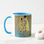The Kiss by Gustav Klimt, Vintage Art Nouveau Mug<br><div class="desc">The Kiss (Der Kuss) (1907/08) by Gustav Klimt is probably his most famous work. Klimt began work on it in 1907 and it is the highpoint of his so-called 'Golden Period'. The Kiss is a vintage Victorian Era Symbolism fine art love and romance painting featuring a romantic couple in various...</div>