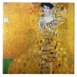 The Lady in Gold, Gustav Klimt Tile<br><div class="desc">Gustav Klimt (July 14, 1862 – February 6, 1918) was an Austrian symbolist painter and one of the most prominent members of the Vienna Secession movement. Klimt is noted for his paintings, murals, sketches, and other objets d'art. In addition to his figurative works, which include allegories and portraits, he painted...</div>