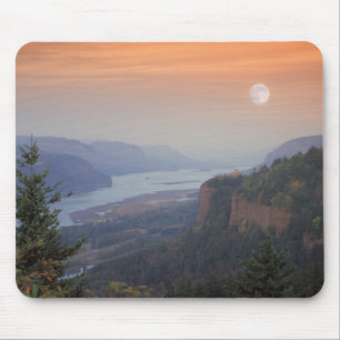 The moon hangs in the sky above the Vista Mouse Mat