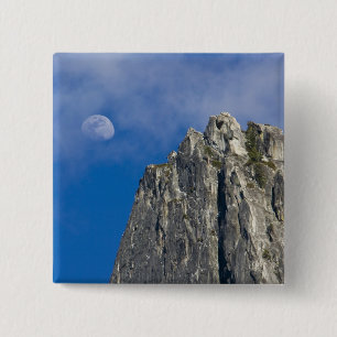 The moon rises and shines through the clouds 15 cm square badge