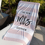 The New Mrs. | Personalised Bride Beach Towel<br><div class="desc">Our sweet personalised bride beach towel makes a perfect honeymoon gift for a newly married friend! Design features "The New Mrs. [lastname]" in modern, trendy black typography on a blush pink and white striped background. Easily customise with the bride's new last name using the field provided. Prefer this for a...</div>