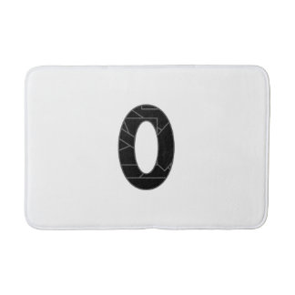 The number zero (0) in black bath mat
