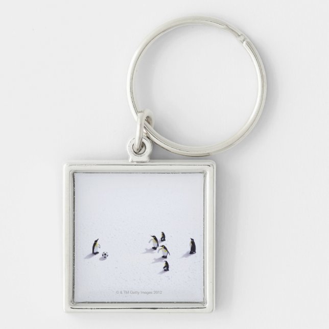 The penguins playing soccer key ring (Front)