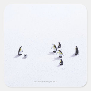 The penguins playing soccer square sticker