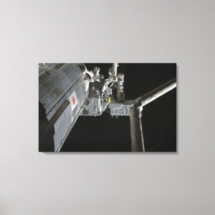 The robotic arm of the Japanese Experiment Modu Canvas Print