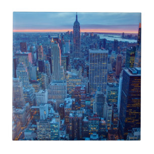 The skyscrapers of Manhattan are lit Tile