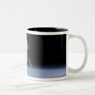 The Soyuz TMA-11 spacecraft above Earth's horiz Two-Tone Coffee Mug