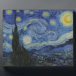 The Starry Night Plaque<br><div class="desc">The Starry Night by Vincent van Gogh The Starry Night is a painting by Dutch post-impressionist artist Vincent van Gogh. The painting depicts the view outside his sanitorium room window at night, although it was painted from memory during the day. The centre part shows the village of Saint-Rémy under a...</div>
