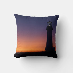 The sun ball drops down on the colourful horizon cushion