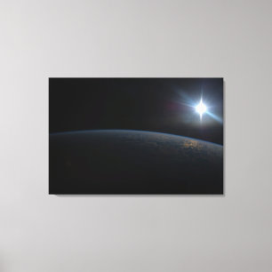 The Sun Setting Over Earth's Horizon. Canvas Print