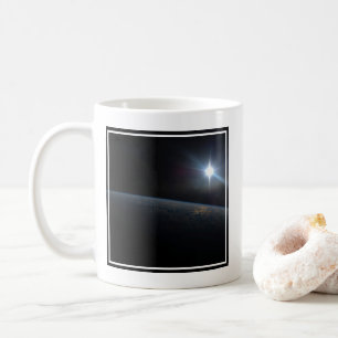 The Sun Setting Over Earth's Horizon. Coffee Mug