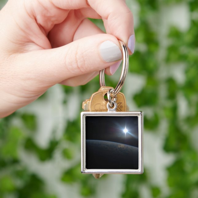 The Sun Setting Over Earth's Horizon. Key Ring (Hand)