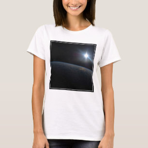 The Sun Setting Over Earth's Horizon. T-Shirt