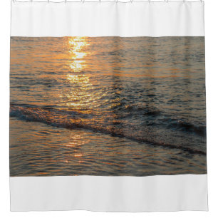 The sunset reflection on the beautiful ocean water shower curtain