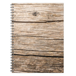 The texture of an old wooden log without bark with notebook