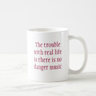 The trouble with real life is there is no dange... coffee mug