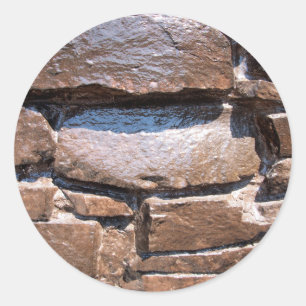 The wall of the large natural stone, painted brown classic round sticker