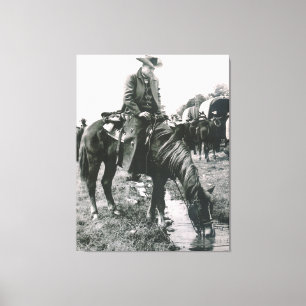 The Watering Hole Cowboy On Horse Canvas Print