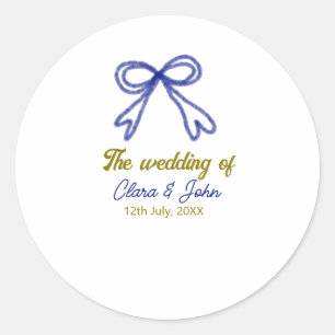 The wedding of gold navy blue bow couple name classic round sticker
