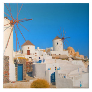 The white buildings and the windmills on the tile