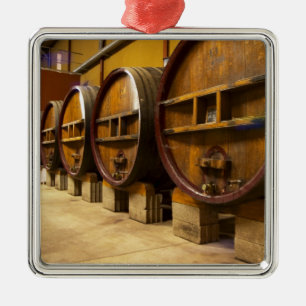 The wine cellar winery with big old wooden casks metal tree decoration
