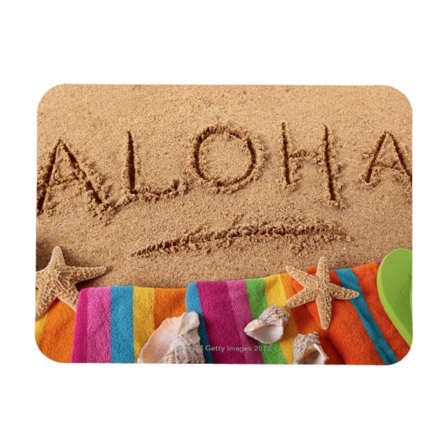 The word Aloha written on a sandy beach, with Magnet (Horizontal)
