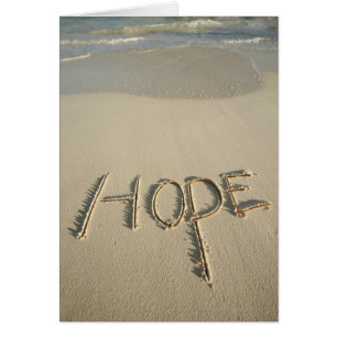 The word 'Hope' sand written on the beach with